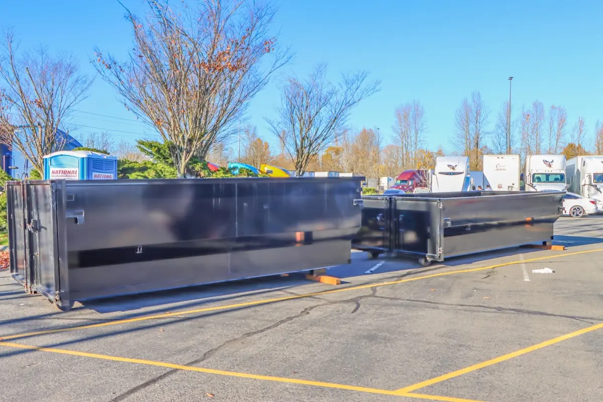 Professional dumpster rental service with roll-off container on residential driveway in Lunenburg